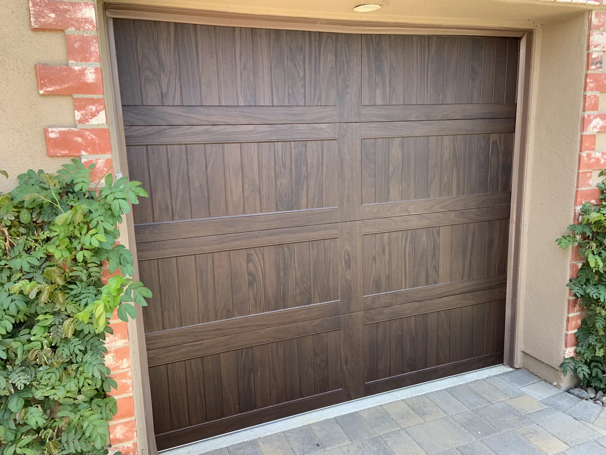 Brown woodgrain raised panel garage door