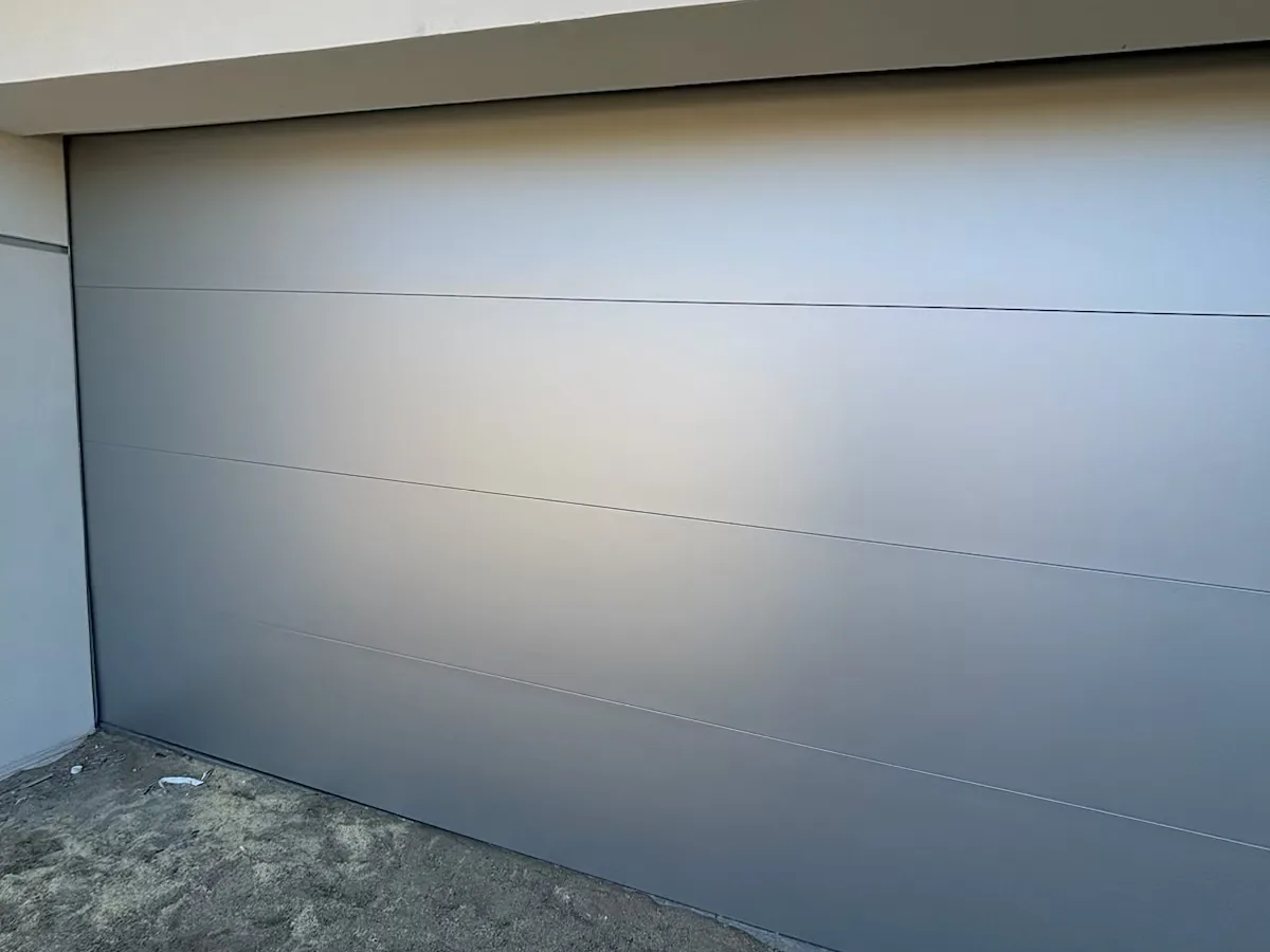 White flush garage door on a two car garage