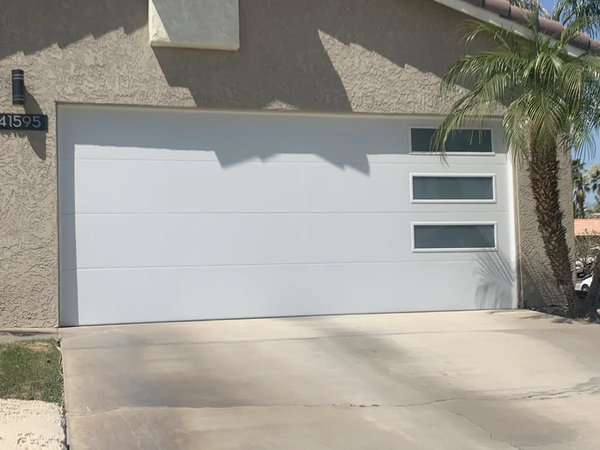 White garage door with vertical window slots