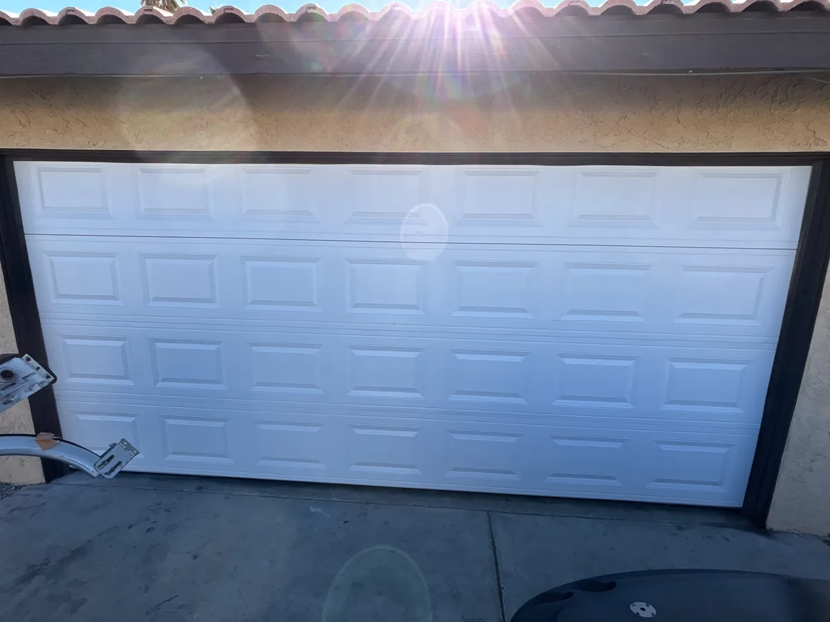 White raised panel garage door on a two car garage